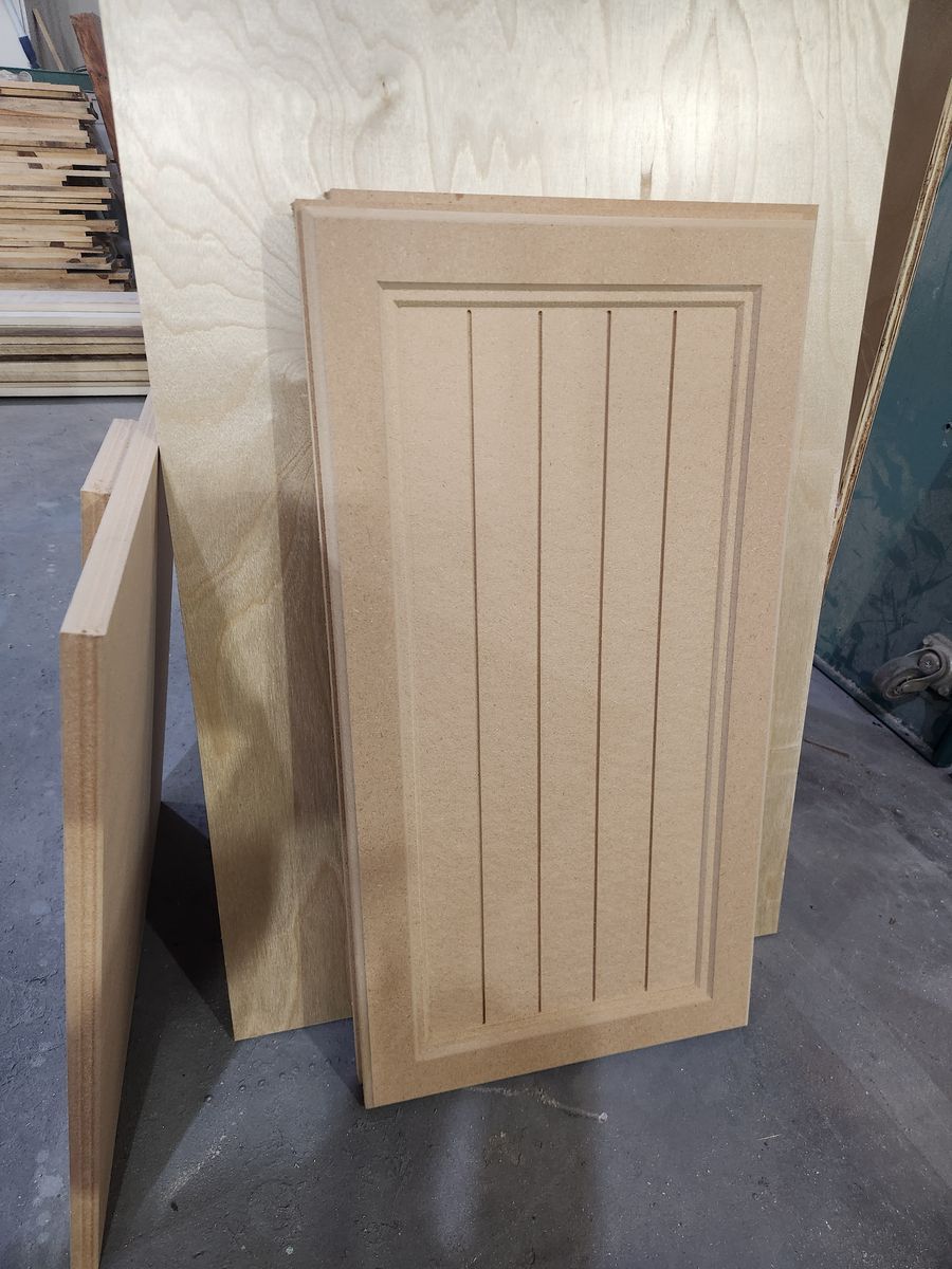 One-piece MDF beadboard cabinet door with vertical grooves in a recessed panel